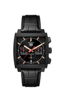 Men's luxury watch with black square dial, leather strap, and rose gold details