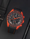 Omega x Swatch Moonswatch Mission on Earth with black textured rubber strap, orange case